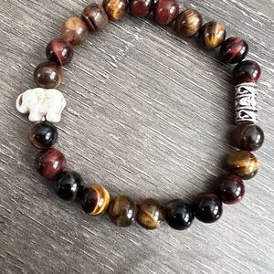 Exquisite AAA+ tigers eyes gemstone bracelet with white turquoise elephant.